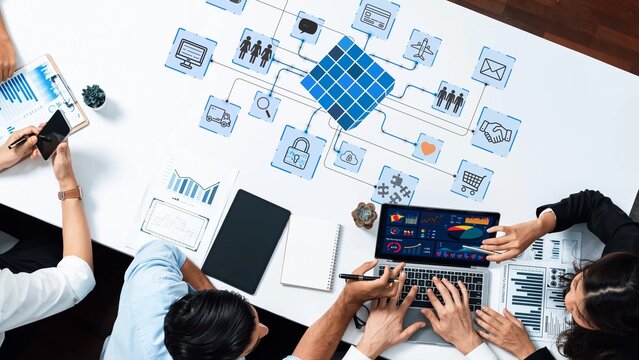 Collaborative Business Meeting with Data Analysis and Digital Networking Concepts in Modern Office Setting. Entropy.