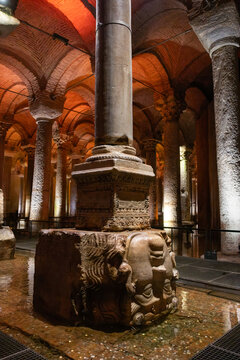 Fatih, Istanbul, Turkiye - 26 July 2026: View of the Medusa head column base in the historic Basilica Cistern with illuminated stone columns and vaulted ceilings.