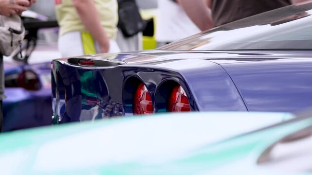 Two round rear taillights of a classic American vintage muscle car, close up detail
