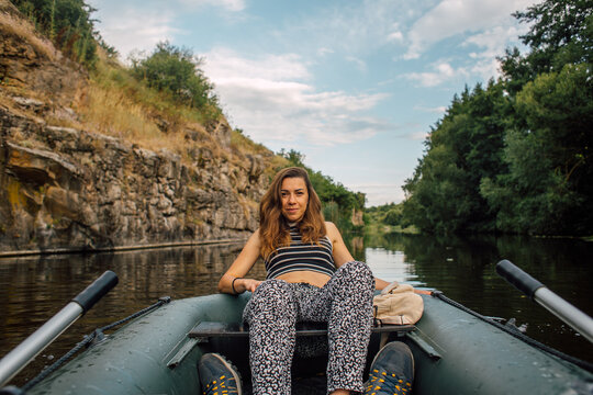 Happy Female Tourist Boating in Scenic Rocky River Canyon
