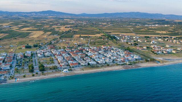 Coastal aerial view of village and beach in Paralia Dionisiou