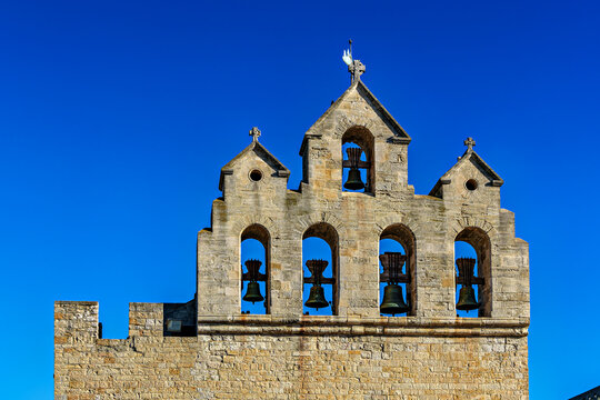 The bell tower on the church notre dame de la mer in Saintes-Maries-de-la-Mer, France.