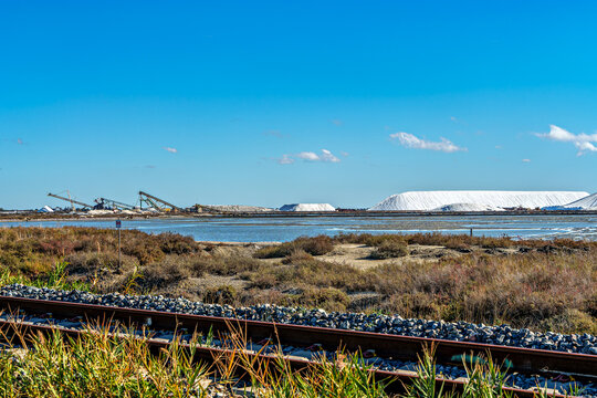 The pink salt lake and the medieval walled Old town of Aigues-Mortes, Camargue, France