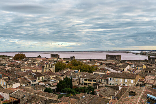The pink salt lake and the medieval walled Old town of Aigues-Mortes, Camargue, France