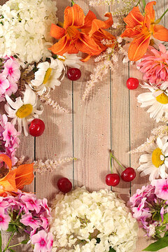 Abstract floral arrangement, background and festive floral concept for summer flyer,banner featuring beautiful garden flowers, daisies, hydrangeas, phlox, cherry blossoms and lilies, reminiscent