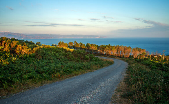 Evening landscape of the peninsula, overlooking the ocean and the coastline with mountains against a sunset sky
