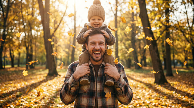 A beautifully detailed photorealistic stock photograph capturing an authentic everyday lifestyle moment of a loving dad carrying his happy toddler in a sunny autumn park.