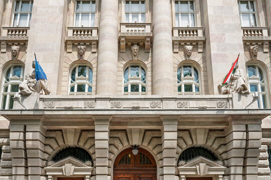 Ionic columns and balcony statues on the main entrance facade of the Hungarian National Bank in Budapest, Hungary