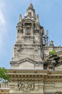 Corner tower of the former Stock Exchange Palace with ornate stonework against a cloudy sky in Budapest, Hungary