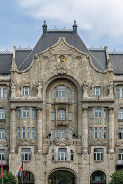 Art Nouveau facade of Gresham Palace with statues flanking the central arched entrance in Budapest, Hungary