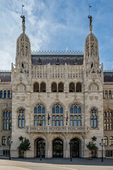 Fototapeta premium Gothic Revival facade of the former Ministry of Interior with twin spired towers and knight statues in Budapest, Hungary