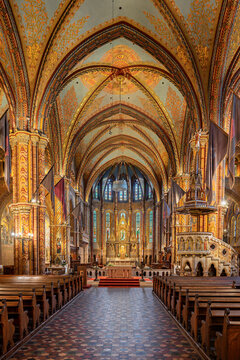 Full interior view of the vaulted nave and gilded sanctuary of Matthias Church in central Budapest, Hungary