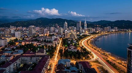 Fototapeta premium Batumi skyline with coastal road at dusk, Georgia
