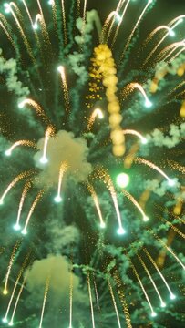 Vertical video: Igniting shell making green-gold burst over camera at night, with smoke for display