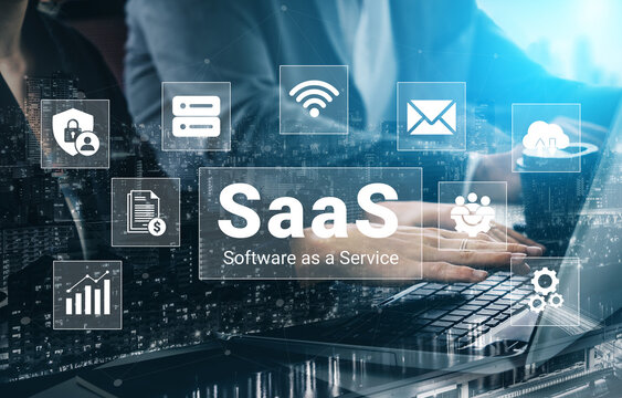 Close-up of hands using a laptop with SaaS icons in a modern digital workspace, showcasing technology role in software solutions and innovative business practices. Ledger