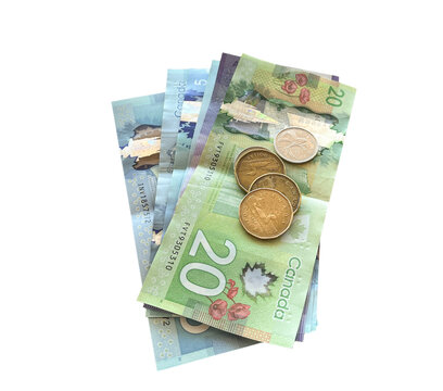 Top view of Canadian currency including paper cash money and coins isolated cutout on transparent background