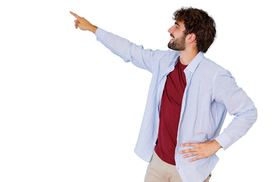 Young man smiling and pointing away with finger, indicating direction or presenting content, copy space, transparent background