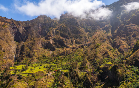 Aerial view of the lush terraced fields and steep rocky slopes of the Trilha do Vale do Paul in Faja de Cima, Paul, Cabo Verde.