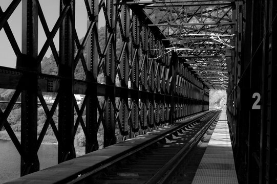 Steel Lattice Railway Bridge Truss and Train Tracks Crossing River