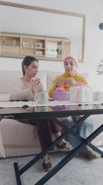 Mother with cancer and her daughter celebrating together at home