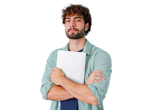 Young man with beard and curly hair holding a laptop, standing confidently with arms crossed, transparent background