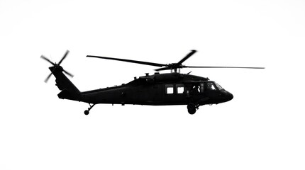 Fototapeta premium Silhouette of a Black Military Helicopter in Flight.