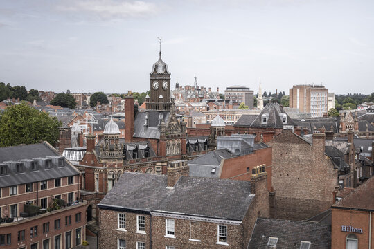 Aerial view of the historic city of York, featuring the prominent clock tower, red brick buildings, and dense urban architecture in York, England, United Kingdom.