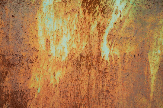 Ultra high resolution macro background texture of an old weathered turquoise and green metallic wall with heavy vertical rust streaks, deep corrosion layers, and flaking paint pattern.