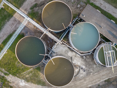 Aerial view of industrial circular tanks and connecting pipelines at the Wieliczka Salt Mine in Wieliczka, Lesser Poland Voivode, Poland.