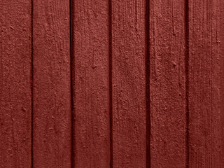 Old painted wooden door texture in barn red with vertical grooves weathered rustic surface detailed background natural grain vintage wall pattern seamless backdrop © the carrot