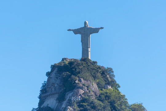 Christ the Redeemer towers over the summit of Corcovado with open arms. Rio de Janeiro, Brazil.