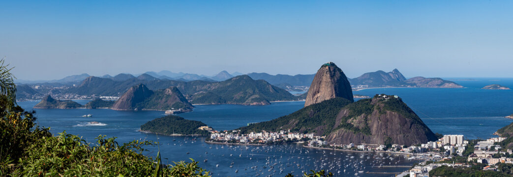 The view from the Dona Marta Lookout reveals Rio de Janeiro, featuring Guanabara Bay, Sugarloaf Mountain, and the city itself. Brazil.