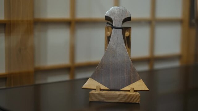 Traditional wooden plectrum for japanese biwa lute, close up