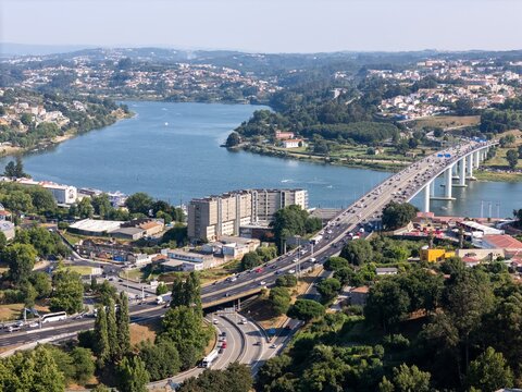Aerial view of Ponte Infante Dom Henrique spanning the Douro River with heavy traffic and surrounding urban landscape in Vila Nova de Gaia, Porto, Portugal.