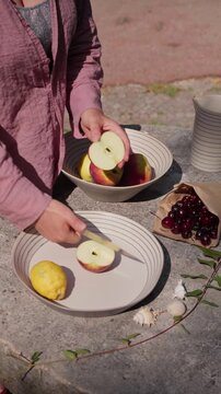 Preparing Fresh Apples and Peaches on a Kitchen Table