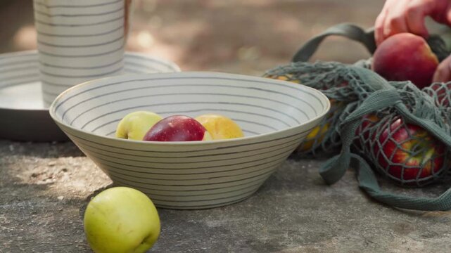 Close-up of Peaches in a Bowl on a Rustic Table