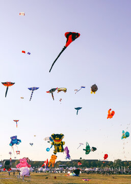 Berlin, Germany - September 27, 2025: Giant kites fill the sky above Tempelhofer Feld during the annual Festival der Riesendrachen, one of Berlin's most popular outdoor autumn events