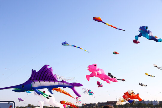 Berlin, Germany - September 27, 2025: Giant kites fill the sky above Tempelhofer Feld during the annual Festival der Riesendrachen, one of Berlin's most popular outdoor autumn events