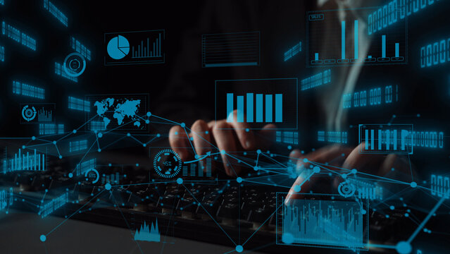 This dynamic image captures a modern workspace where hands type on a keyboard, overlaid with digital analytics, graphs, and data visualization elements illustrating technology-driven insights. Xenic