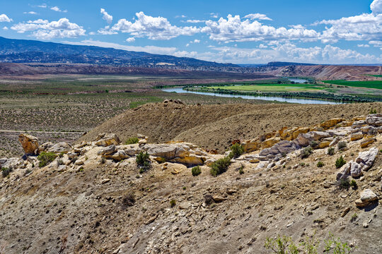 Rocky ridges rise above the Green River at Dinosaur National Monument in Utah, USA