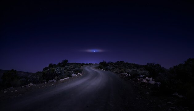 A dark winding road at night leading towards a mysterious distant light under a deep blue sky symbolizing journey exploration and the future
