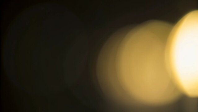 Yellow light leak overlay with glowing bokeh and vintage film burn effect, abstract light background for photo editing, cinematic overlays and creative digital design