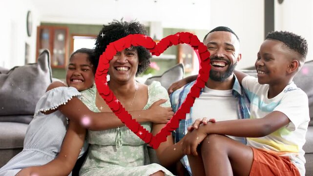 Family sitting sofa while sketch heart appearing over family, filling 3D ring, hugging for health