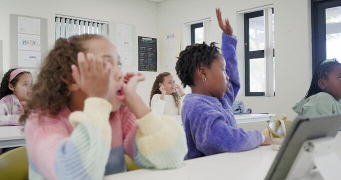Diverse female students raising hands answering while responding to teacher in class with tablet