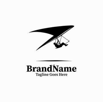 Clean black vector icon of a hang glider pilot gliding through the air, extreme air sports logo on white background