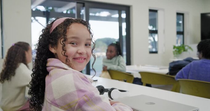 African American girl child turning to camera, smiling at camera zoom in class with laptop, headset