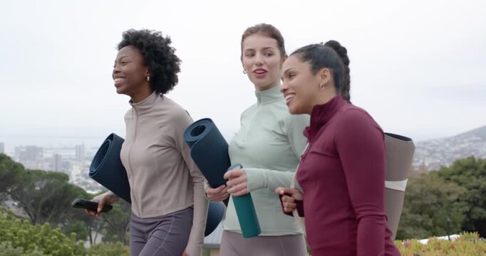Diverse women friends walking hill woman pointing at city drawing looks with mats heading to class