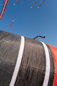 A Janggan kite with a very long tail is flying in the sky over Mertasari Beach, Bali, Indonesia, on July 25, 2026