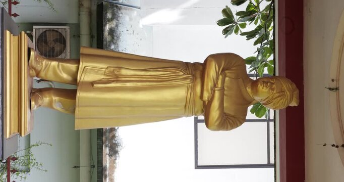 "Close-up View of Golden Swami Vivekananda Bust Statue"
