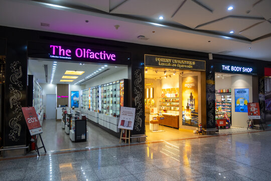 Shopping mall corridor with The Olfactive and beauty stores